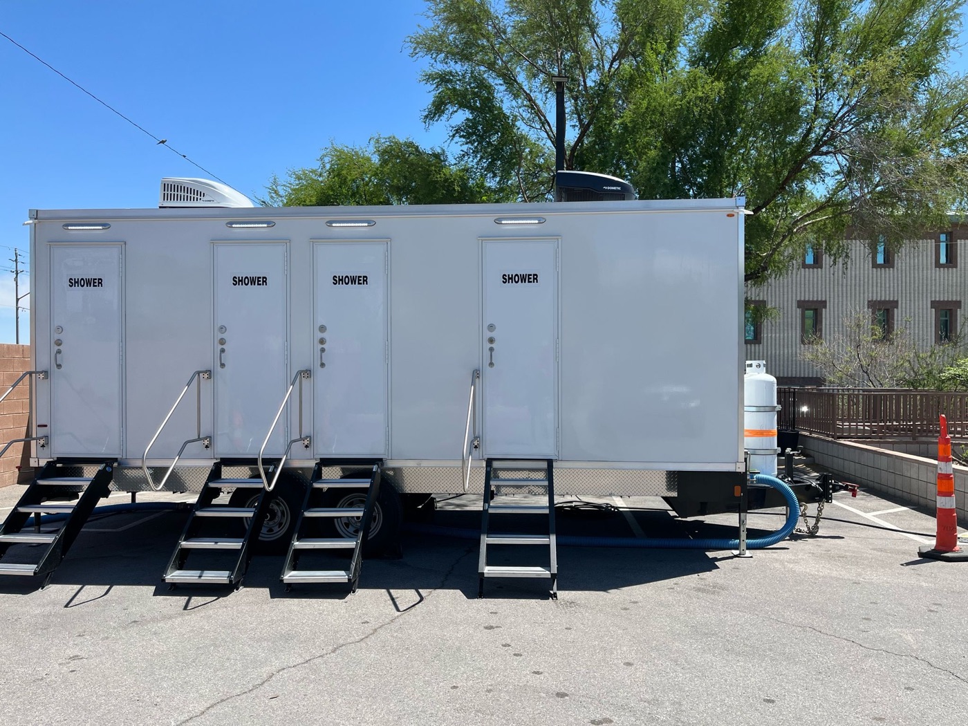 Four stall shower trailer on a paved lot